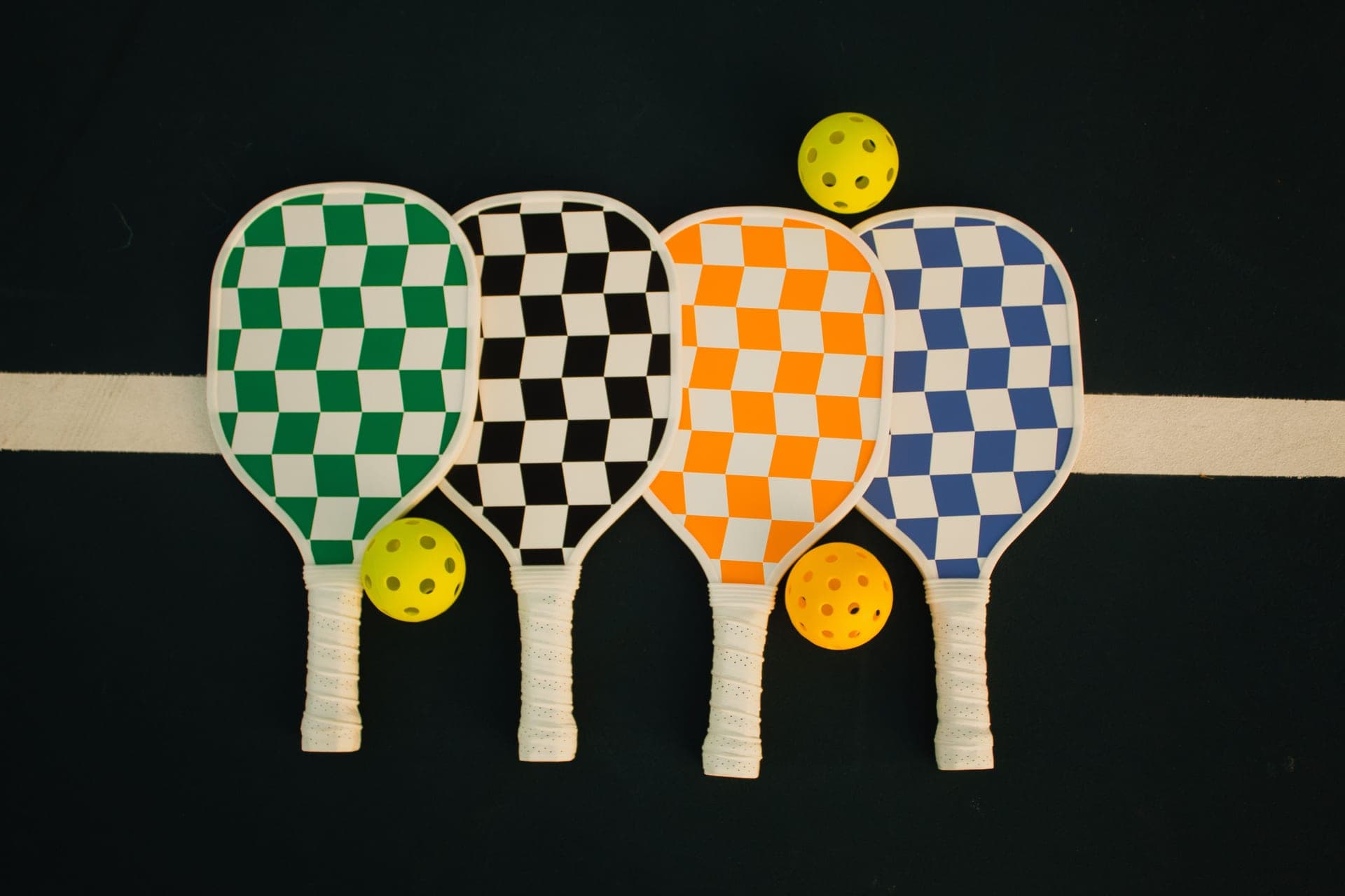 Pickleball paddles and balls arranged as gifts